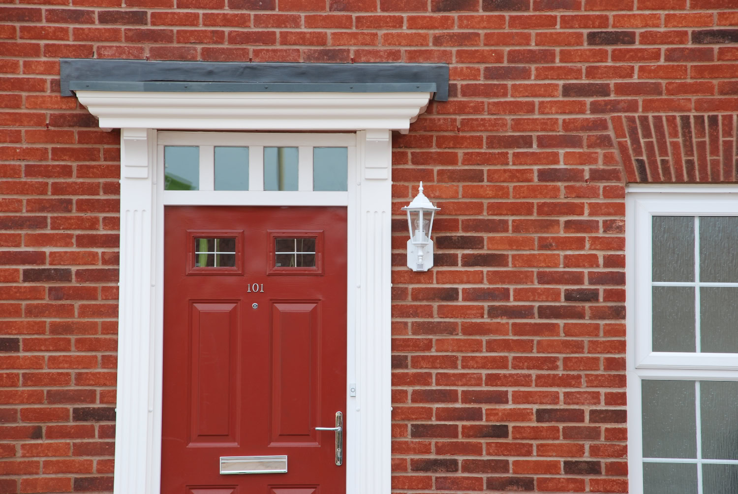 Gate view of a red-bricked house